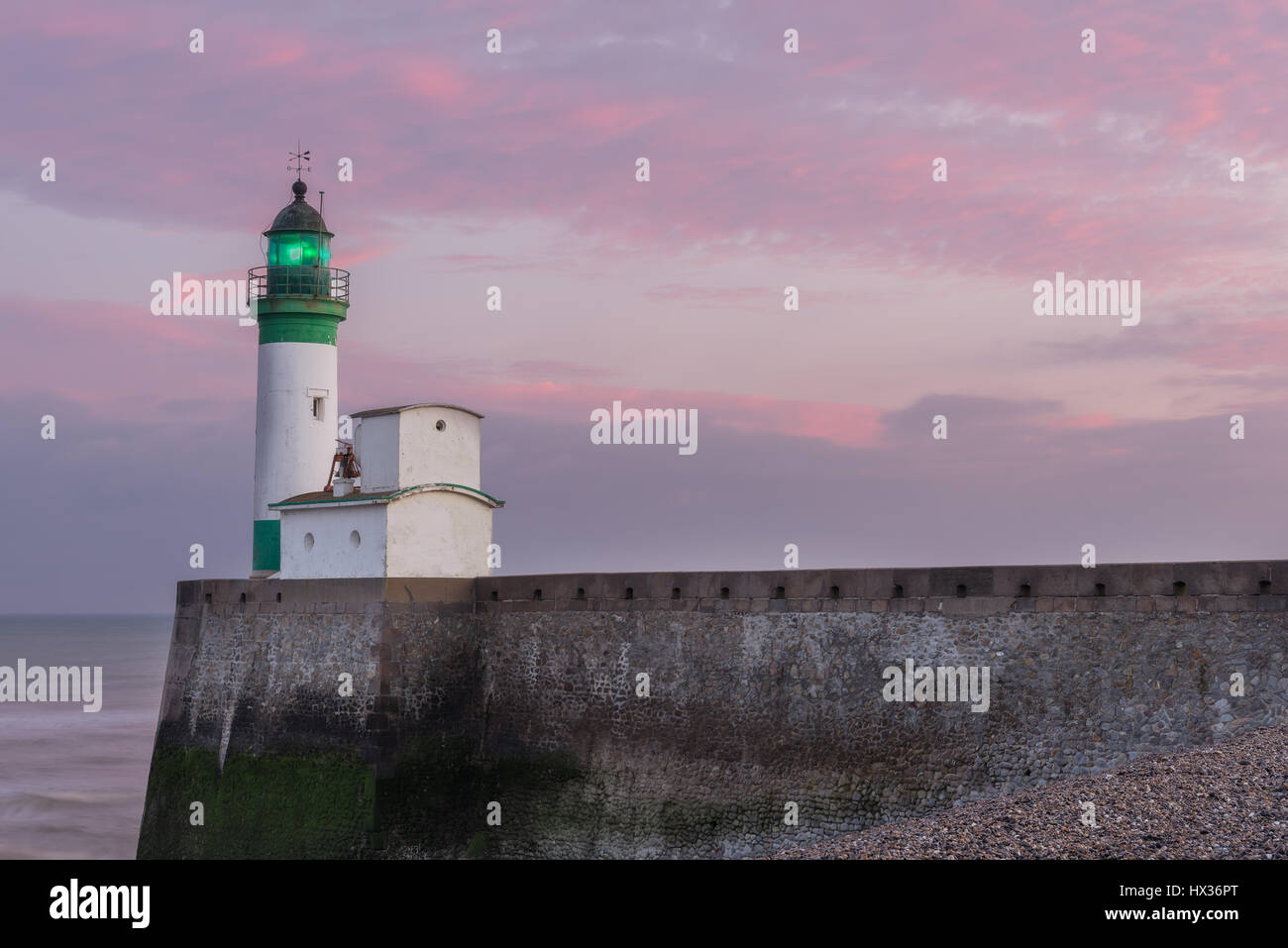 Le Treport Lighthouse at sunset Stock Photo