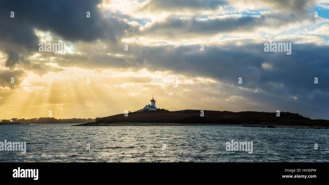 Little french Lighthouse at sunset Stock Photo