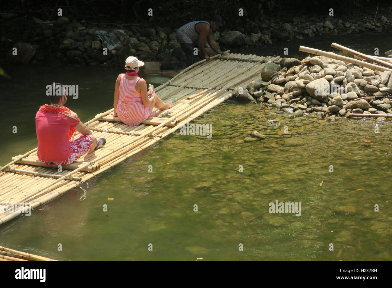 Pushing Raft A start of a bamboo rafting in Phuket. The stream is very calm and ...