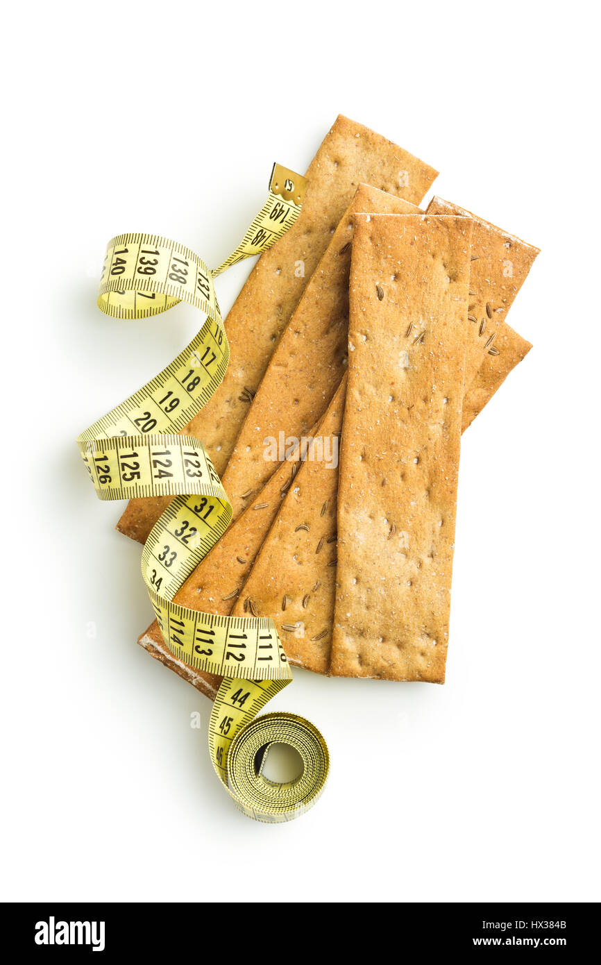 The healthy crispbread with measuring tape isolated on white background. Stock Photo
