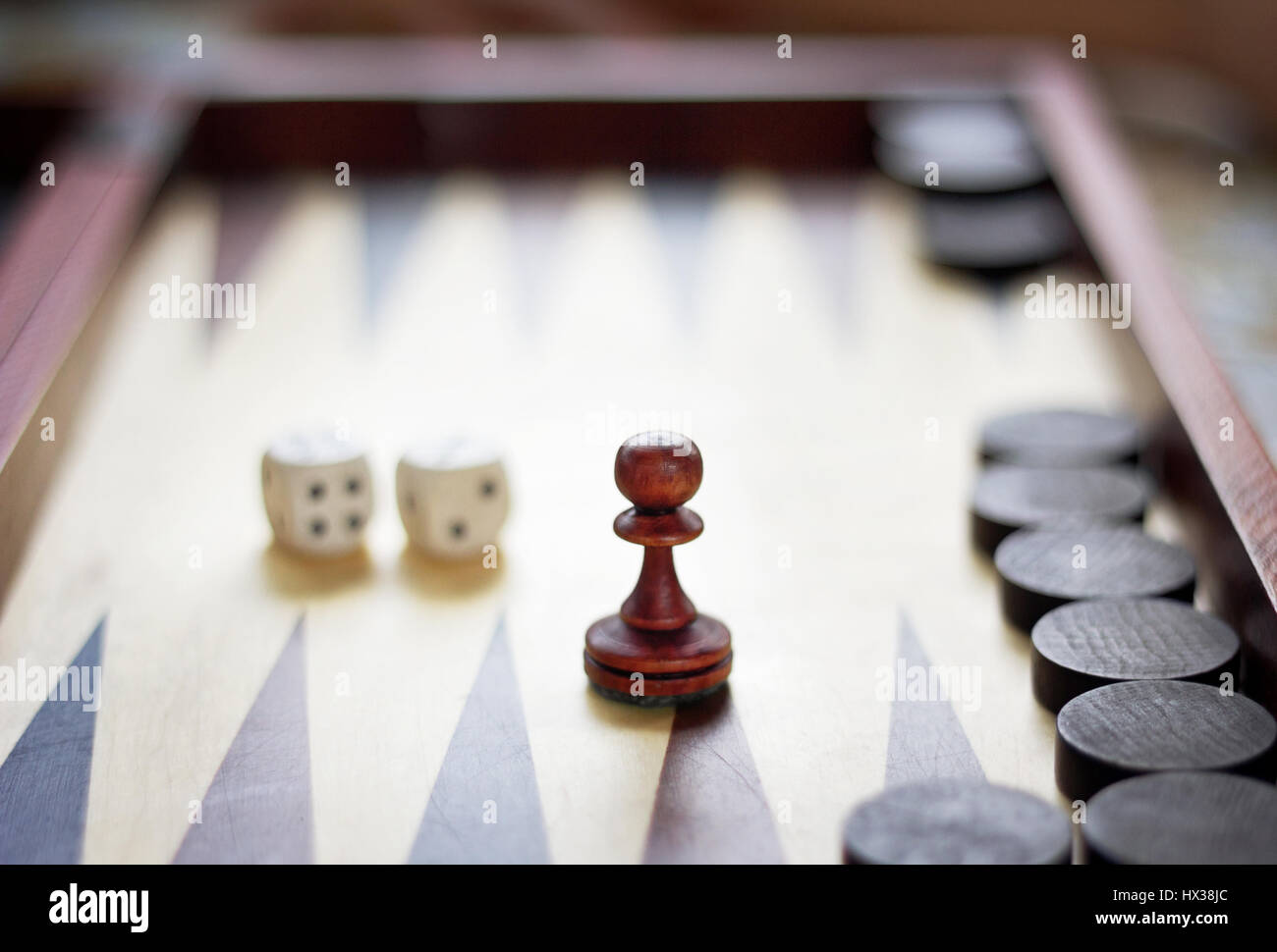 Ponce, loaded dice and backgammon on a board, tabletop games Stock Photo