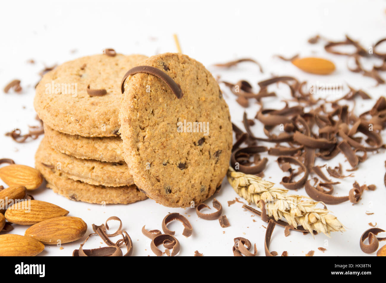 Cookies with almonds and chocolate pieces on white Stock Photo
