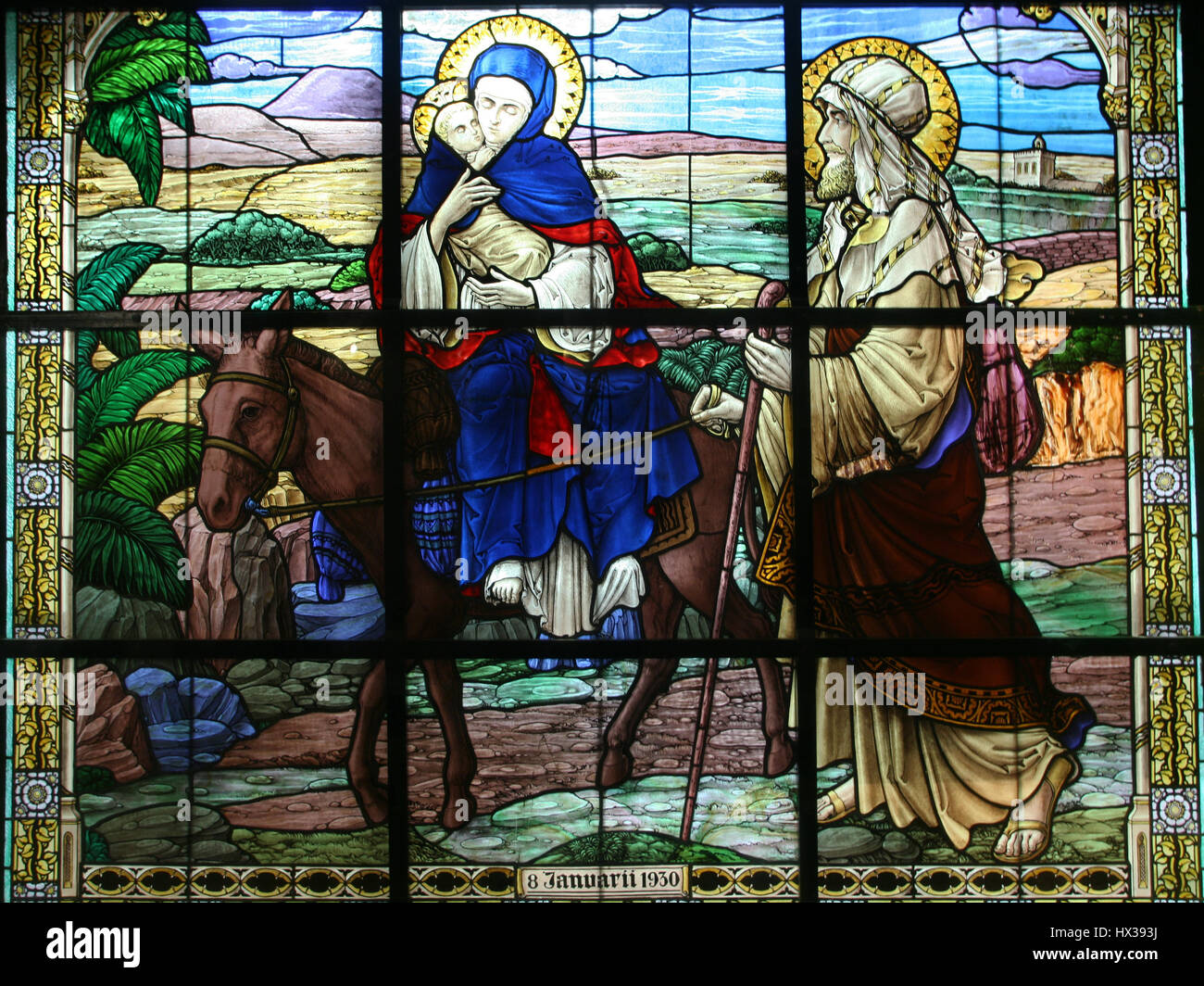 Stained glass in the house Casa Nova, which shows the Flight into Egypt in Bethlehem, Israel Stock Photo