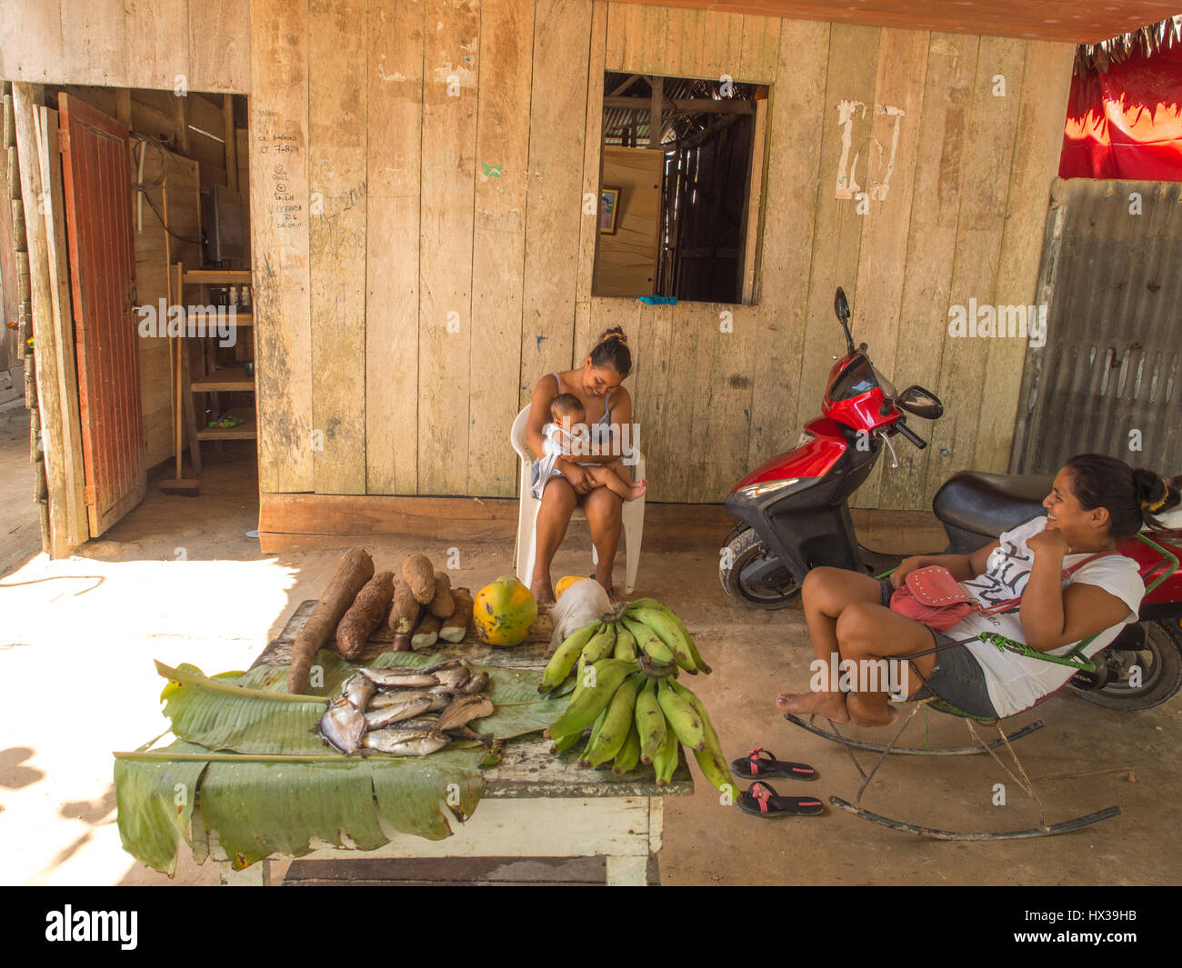 Santo Tomas, Peru - May 17, 2016: Peruvian women and child in the small village near  the Iquitos. Stock Photo