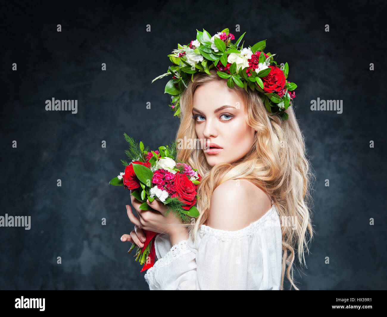 portrait of a beautiful blonde girl with a composition of flowers Stock ...