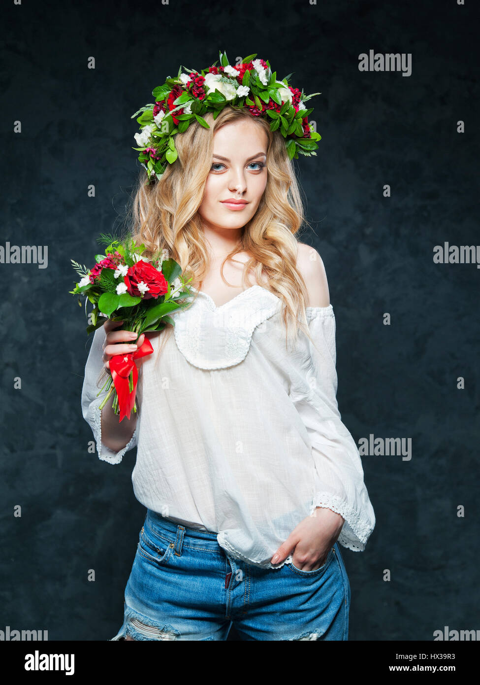 portrait of a beautiful blonde girl with a composition of flowers Stock ...