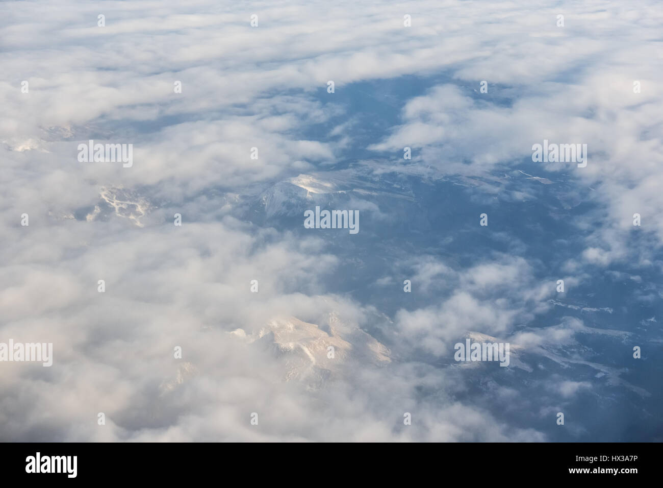 Aerial view of snowy mountains and clouds Stock Photo - Alamy