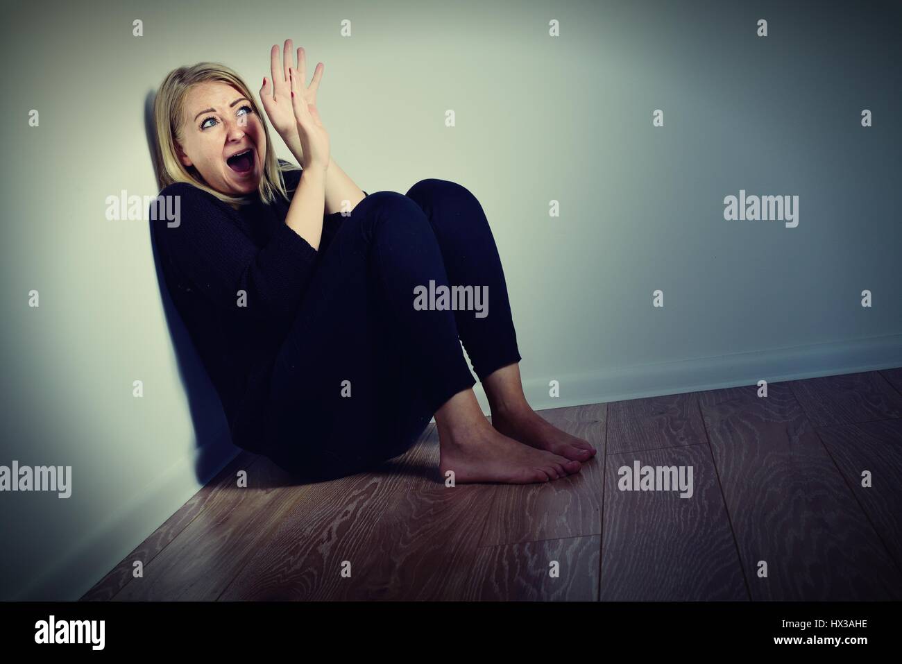 Scared woman. Afraid and screaming. Stock Photo
