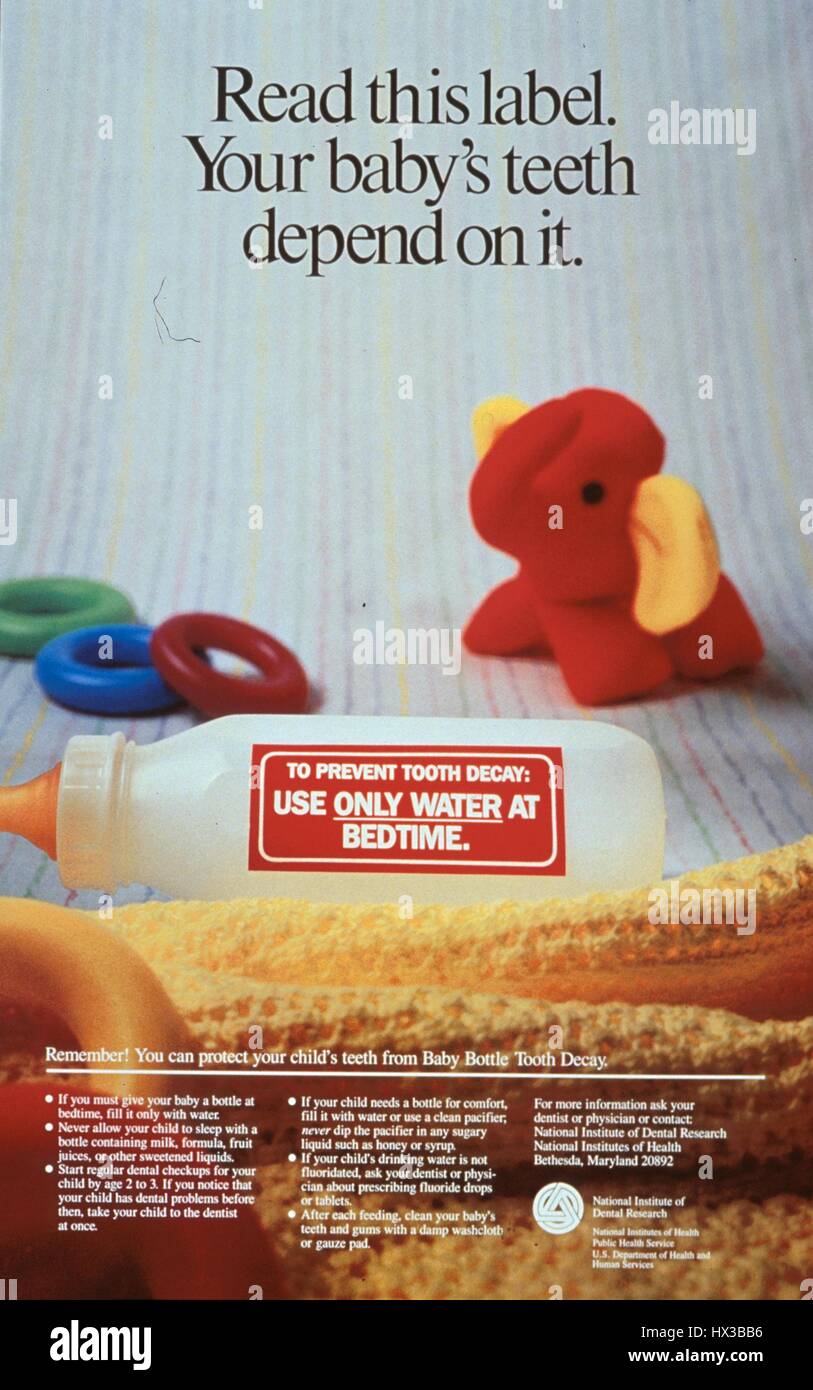 Poster issued by the United States National Institute of Dental Research, depicting a baby bottle and toys, encouraging parents to take measures to prevent their babies' tooth decay, 1985. Courtesy National Library of Medicine. Stock Photo