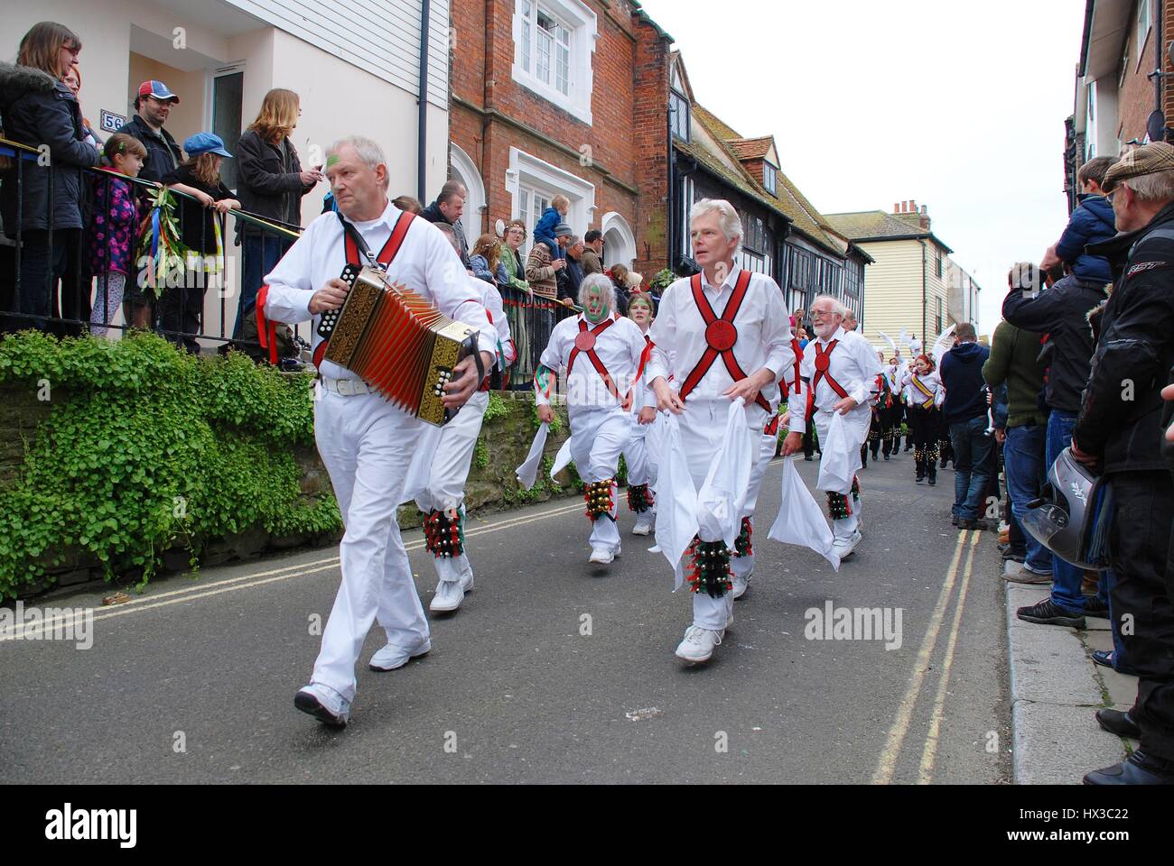 Morris dancers parade through the Old Town during the annual Jack In The Green festival at Hastings in East Sussex, England on May 7, 2012. Stock Photo