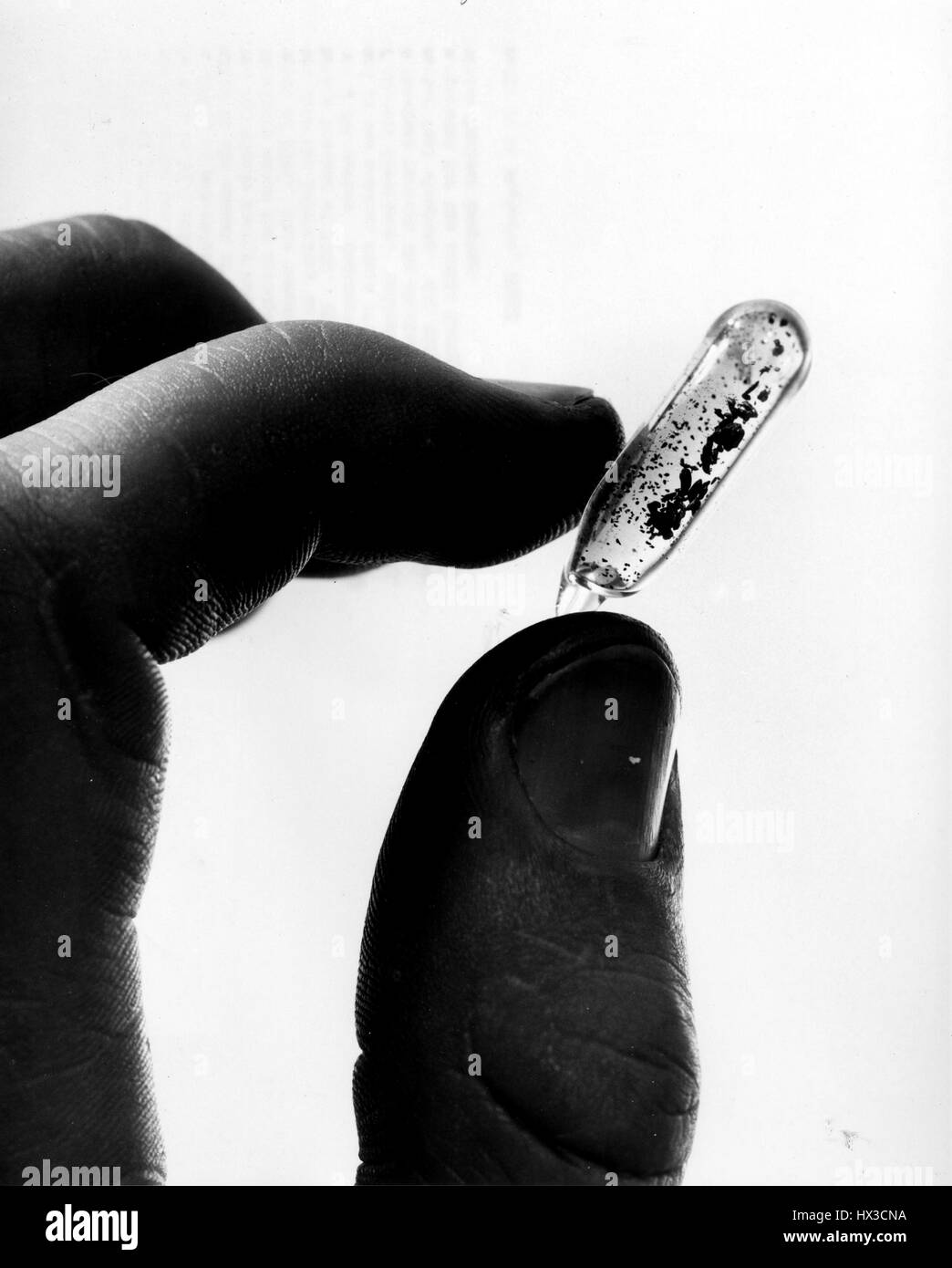 The small amount of material shown in the vial represents more than 14 years of production in the atomic energy field related to the betterment of mankind, 1961. Image courtesy US Department of Energy. Stock Photo