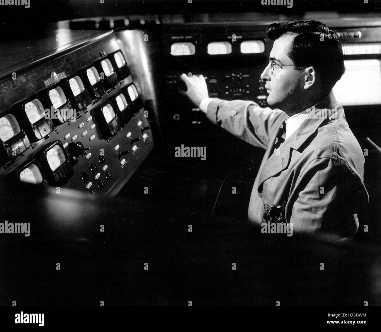 A worker operates the cyclotron at Bookhaven National Laboratory in