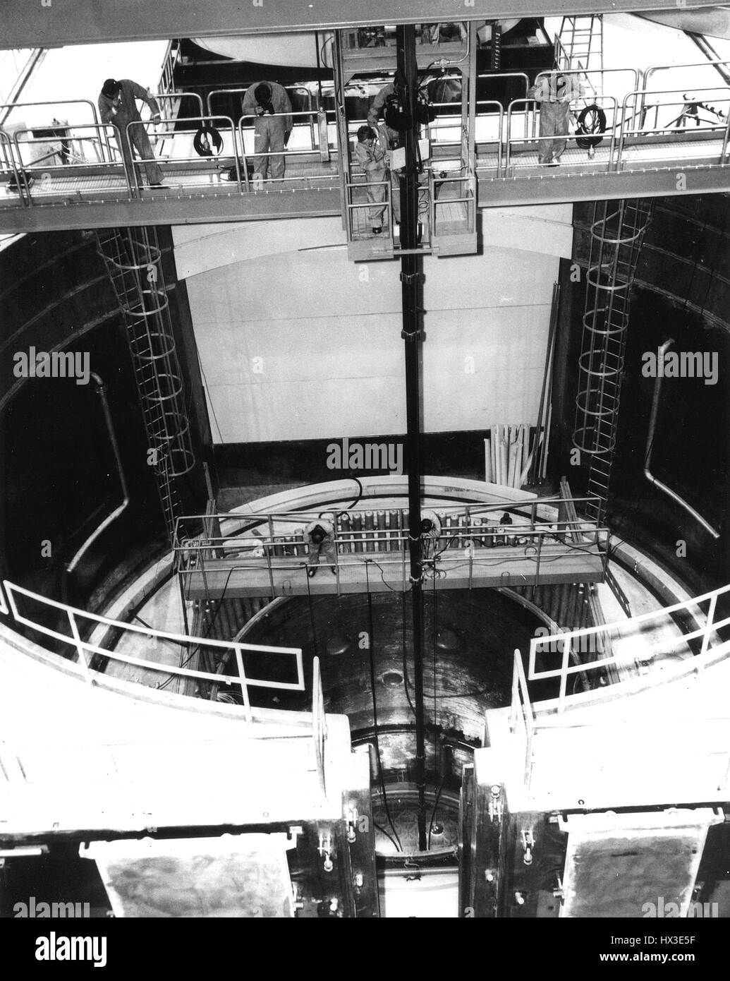 Technicians guide a fuel assembly into the Commonwealth Edison Company