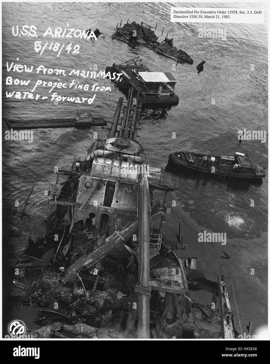 View of USS Arizona from the main mast with bow projecting from the water, May 18, 1942. Image courtesy National Archives. Stock Photo