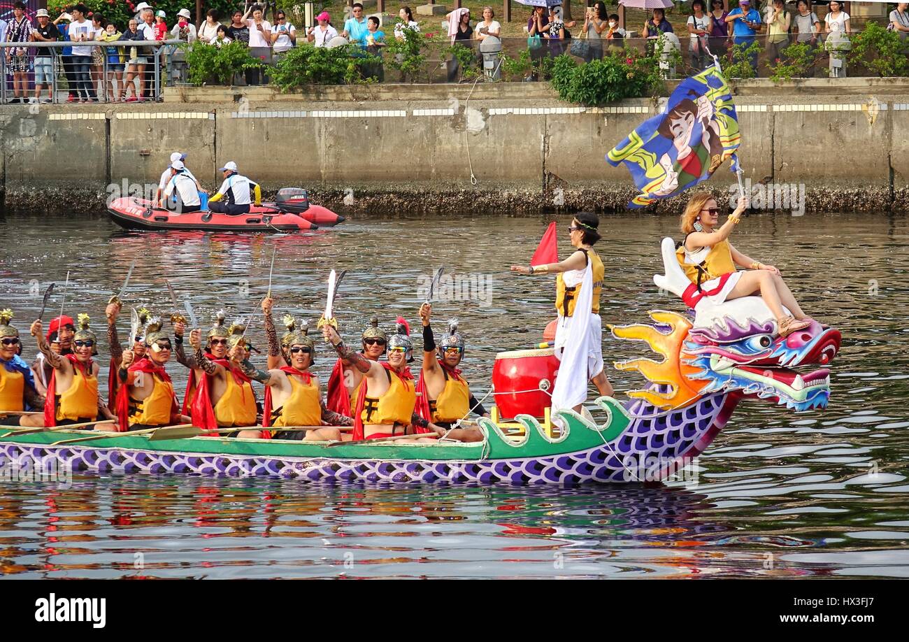 KAOHSIUNG, TAIWAN -- JUNE 20, 2015: A Dragon Boat team is dressed up as computer game characters for promotional purposes during the annual Dragon Boa Stock Photo