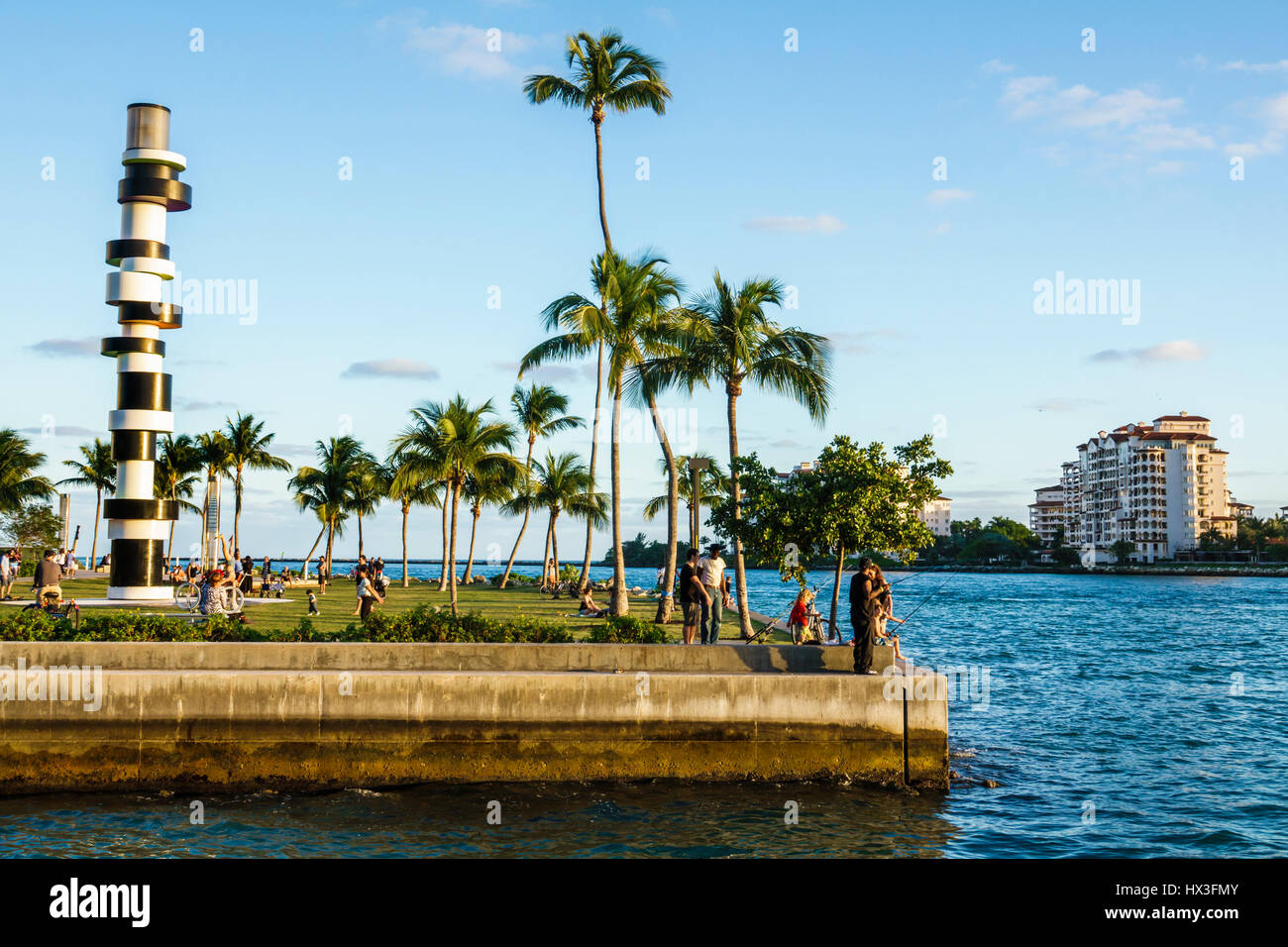 Miami Beach Florida,South Pointe Park,public park,lawn,Art in Public Places,Obstinate Lighthouse,sculpture,Tobias Rehberger,palm trees,waterfront,wate Stock Photo