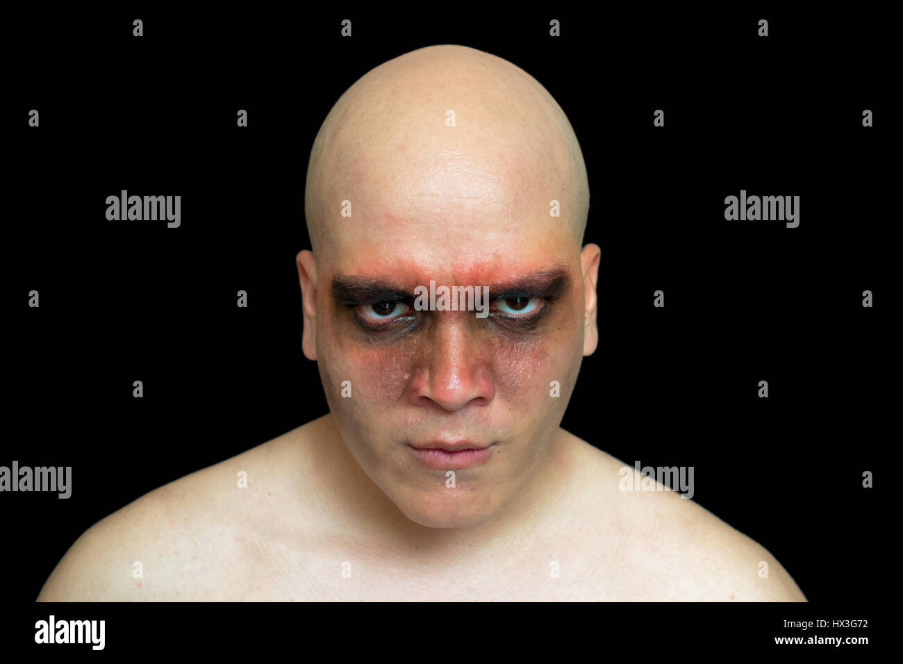 Angry Man with makeup on his eyes Stock Photo Alamy