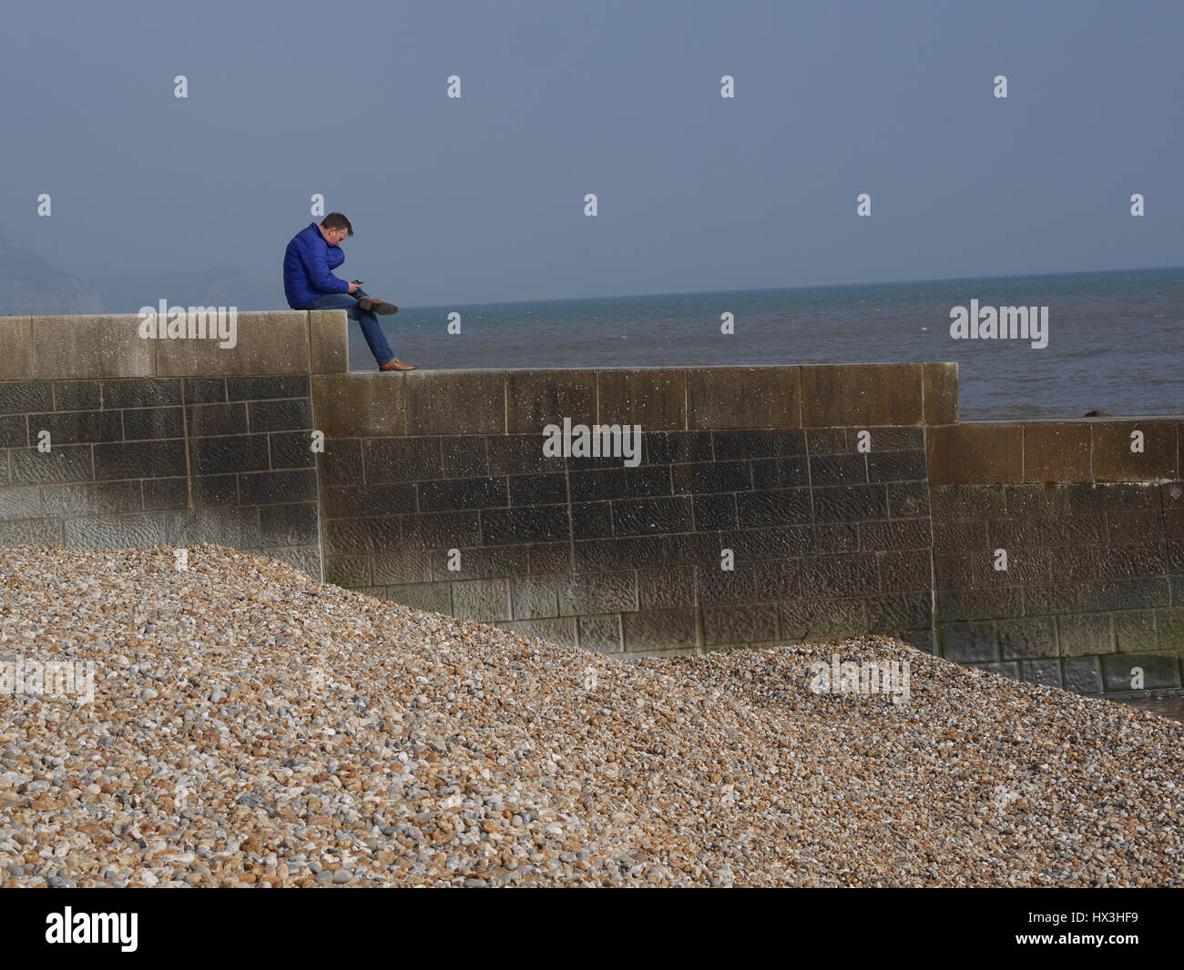 Person looking out to sea Stock Photo Alamy