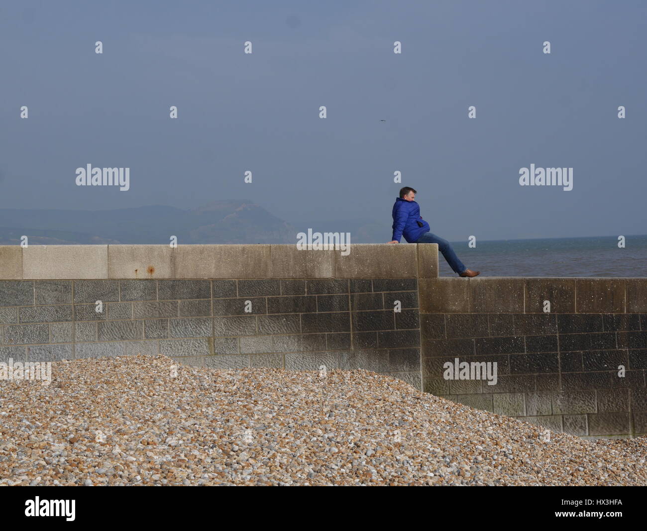 Person looking out to sea Stock Photo Alamy