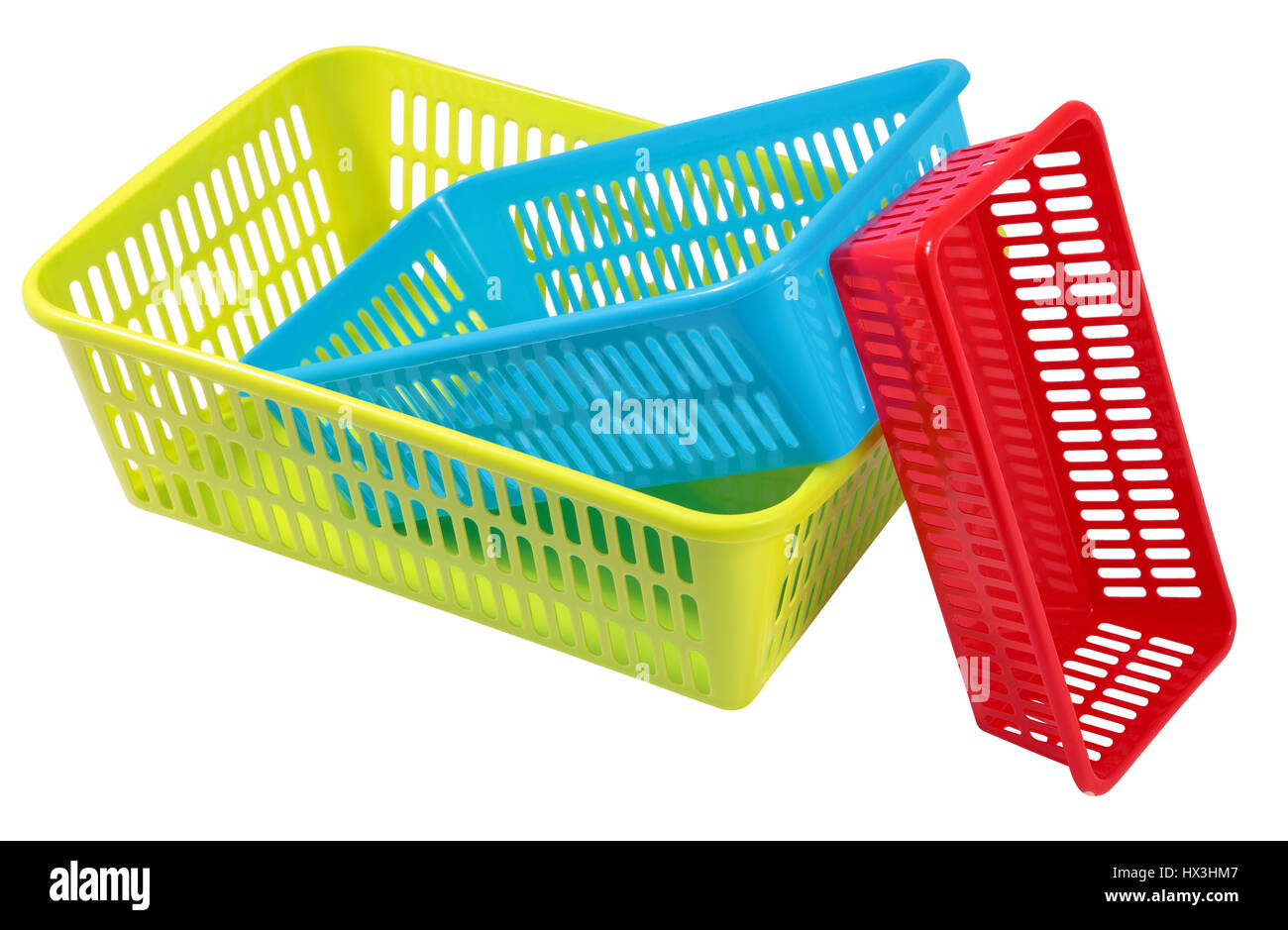 Several small different colored plastic baskets for household use Stock