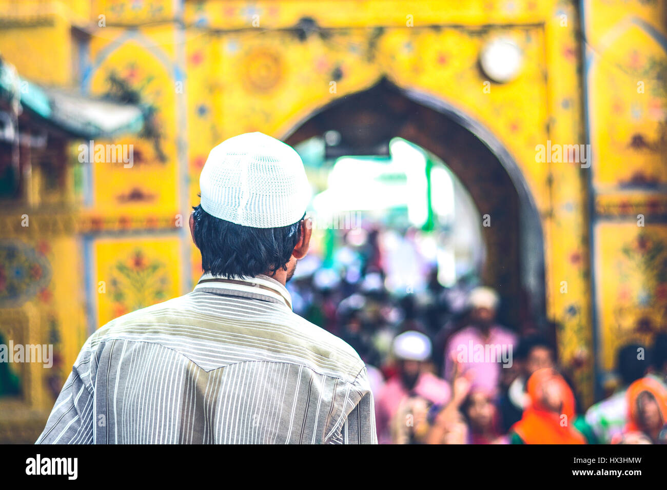 A man wearing a skull cap going to the Ajmer Sharif Dargah for offering Namaz Stock Photo
