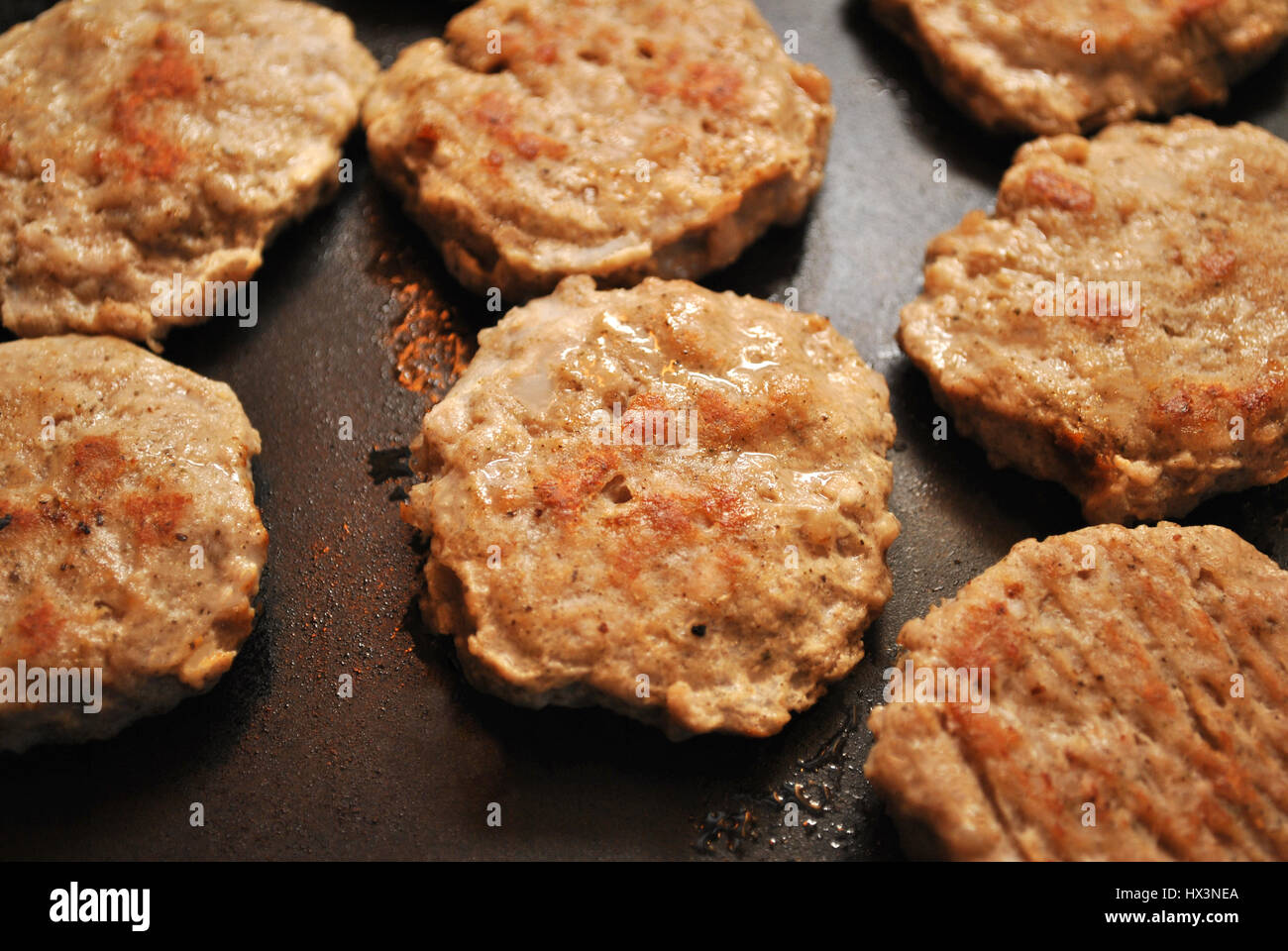 Round Breakfast Sausage Cooking on a Griddle Stock Photo Alamy
