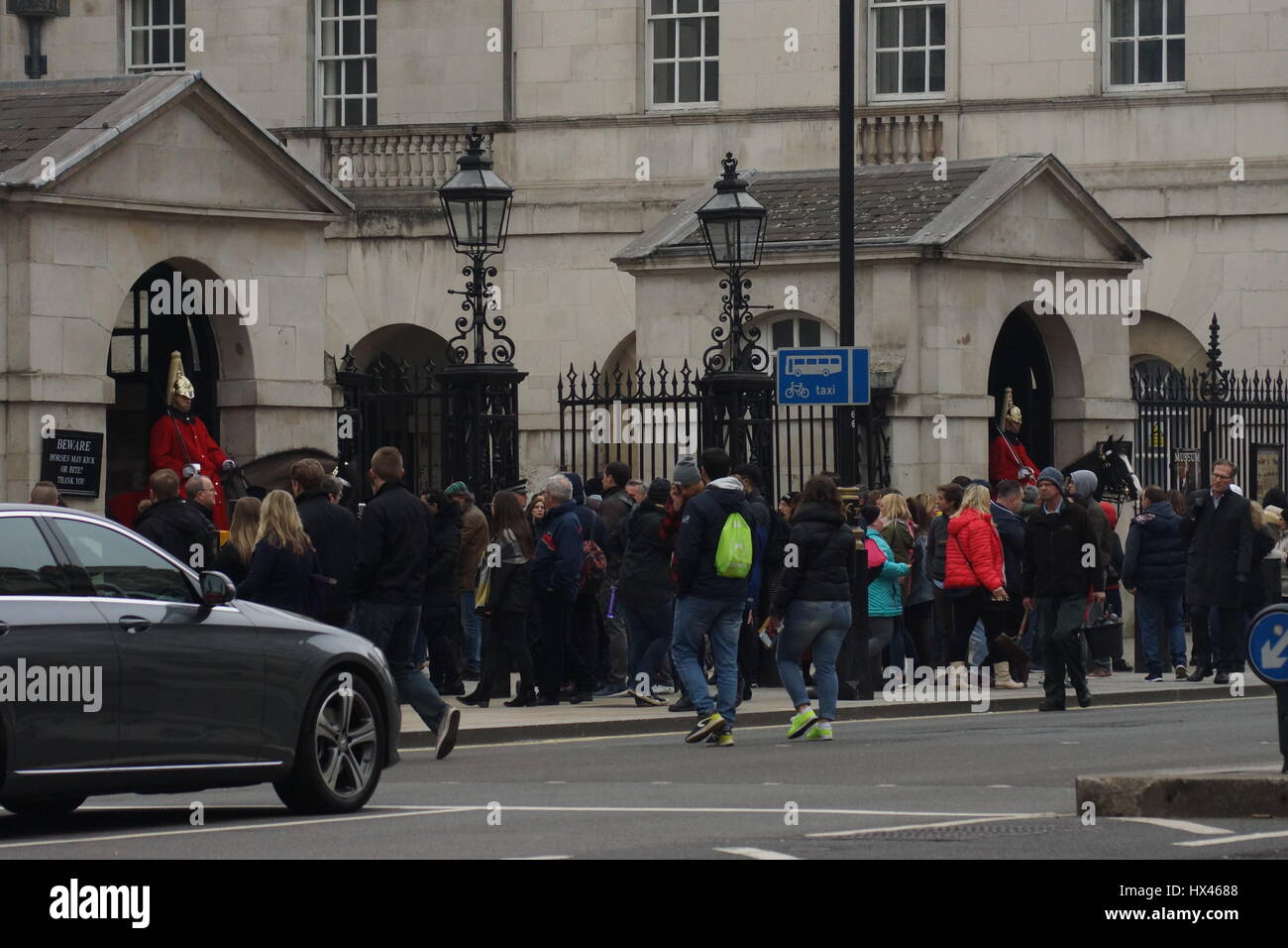 London, UK. 23rd Mar, 2017. Tourists flock to see the Household Cavalry at Horse Guards in the wake of the murder of PC Keith Palmer by Khalid Massood, also known as Adrian Elms, also known as Adrian Russell Ajao on Wednesday 21 March 2017. Members of the public pay floral tribute whilst television journalists make their reports and police officers survey the scene. Credit: Peter Hogan/Alamy Live News Stock Photo