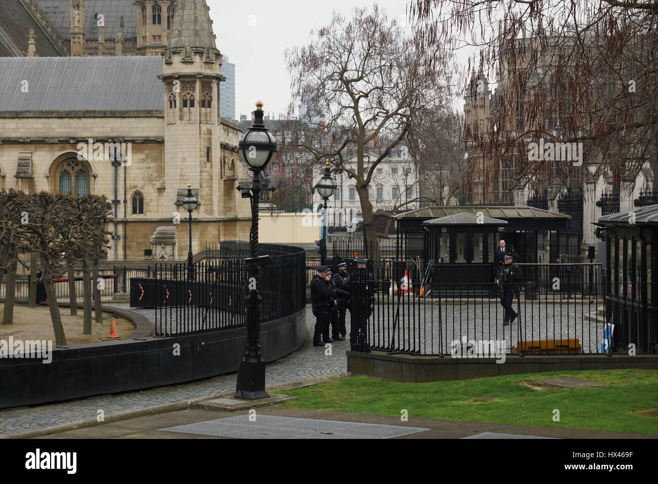 London, UK. 23rd Mar, 2017. Armed police at the scene outside the Houses of Parliament in the wake of the murder of PC Keith Palmer by Khalid Massood, also known as Adrian Elms, also known as Adrian Russell Ajao on Wednesday 21 March 2017. Members of the public pay floral tribute whilst television journalists make their reports and police officers survey the scene. Credit: Peter Hogan/Alamy Live News Stock Photo