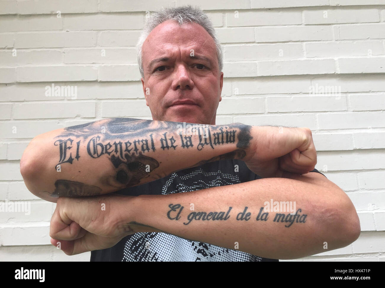 Medellin, Colombia. 7th Mar, 2017. Jhon Jairo Velásquez alias "Popeye",  former contract killer for Colombia's drog boss Escobar, shows his lower  arms, which are tattoeed with "El General de la Mafia" (The