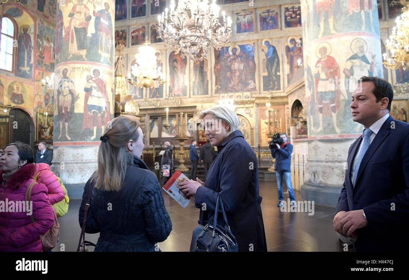 Moscow, Russia. 24th March 2017. Leader of the National Front and French Presidential candidate Marine Le Pen, center, tours the an Orthodox cathedral in the Kremlin with Putin aide Igor Shchegolev, right, prior to meeting with the Russian president March 24, 2017 in Moscow, Russia. Credit: Planetpix/Alamy Live News Stock Photo