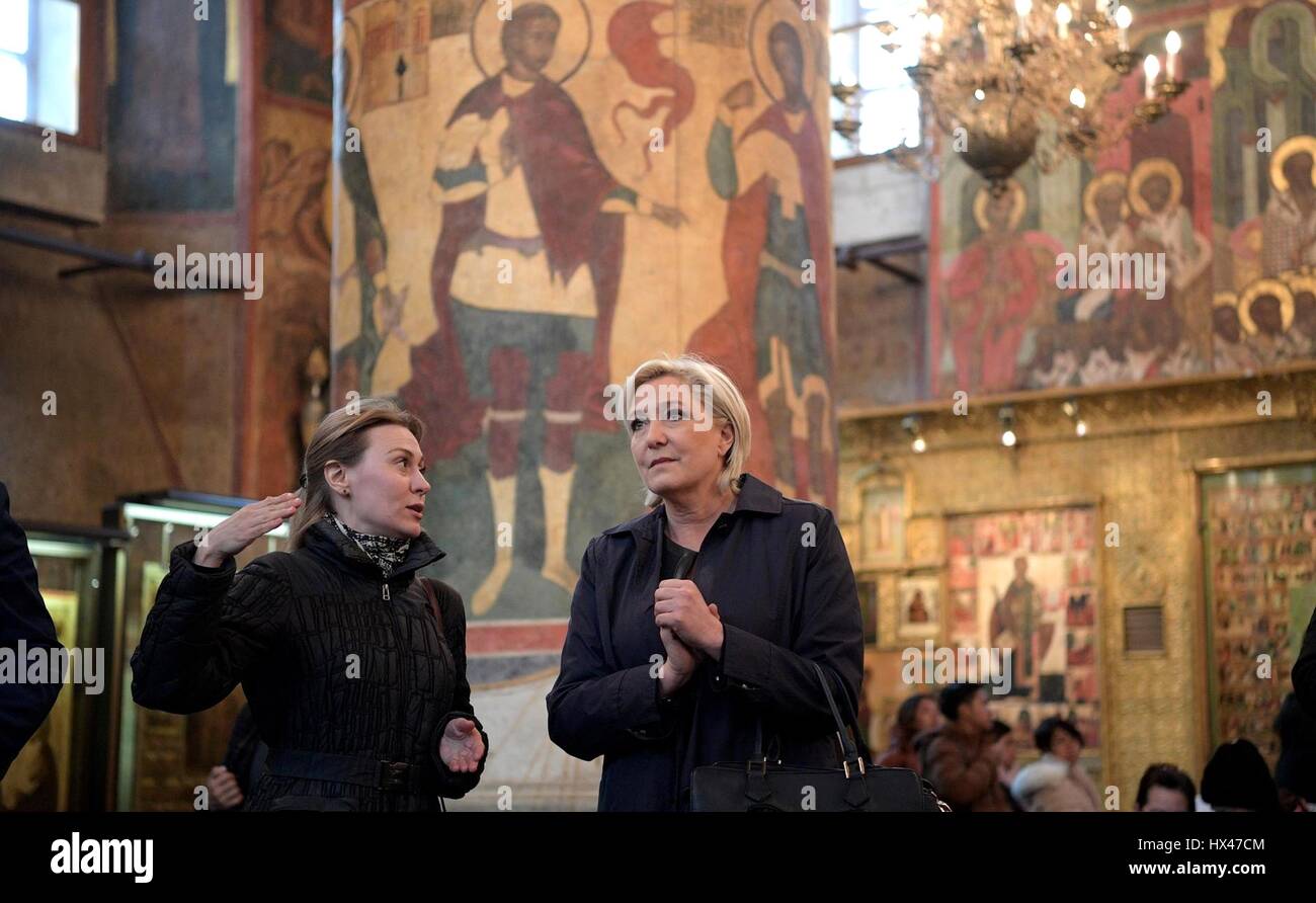 Moscow, Russia. 24th March 2017. Leader of the National Front and French Presidential candidate Marine Le Pen, right, tours the an Orthodox cathedral in the Kremlin with a guide prior to meeting with the Russian president March 24, 2017 in Moscow, Russia. Credit: Planetpix/Alamy Live News Stock Photo