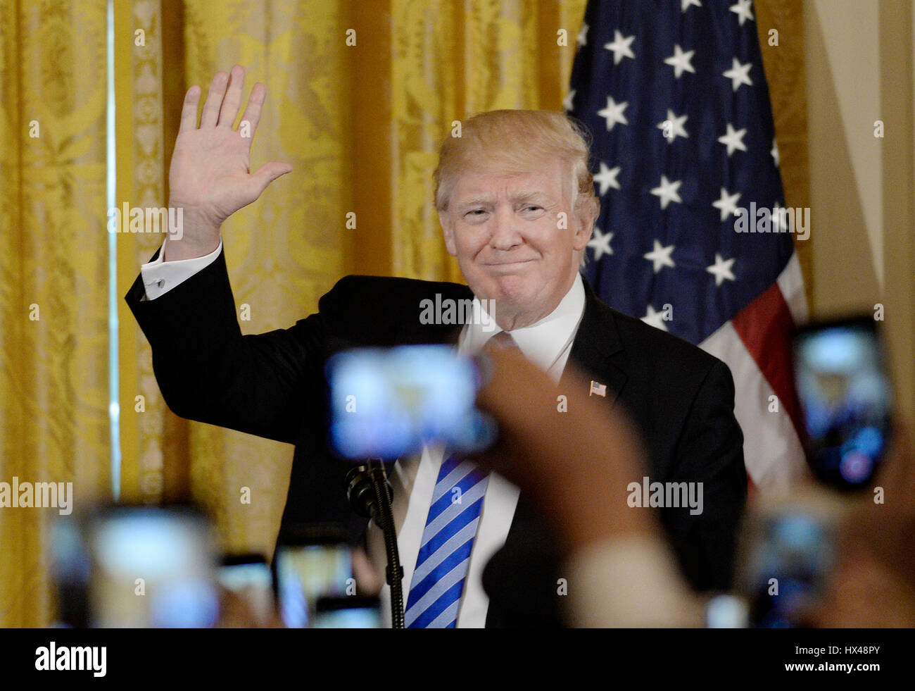 United States President Donald Trump waves during an event to celebrate ...