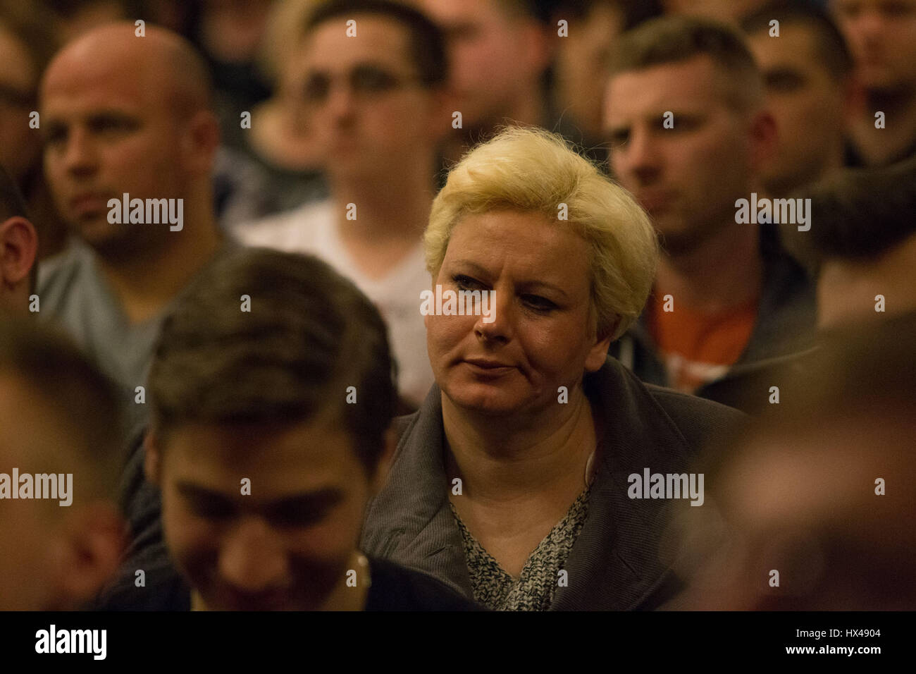 Bydgoszcz, Poland. 24th Mar, 2017. Bydgoszcz, Poland. March 25th, 2017. A woman is seen attending a talk by right wing MEP Janusz Korwin-Mikke. Mr Korwin-Mikke has been temporarily suspended from parliament after misogynist remarks in a debate on gender pay equality on March 1st. Credit: Jaap Arriens/Alamy Live News Stock Photo