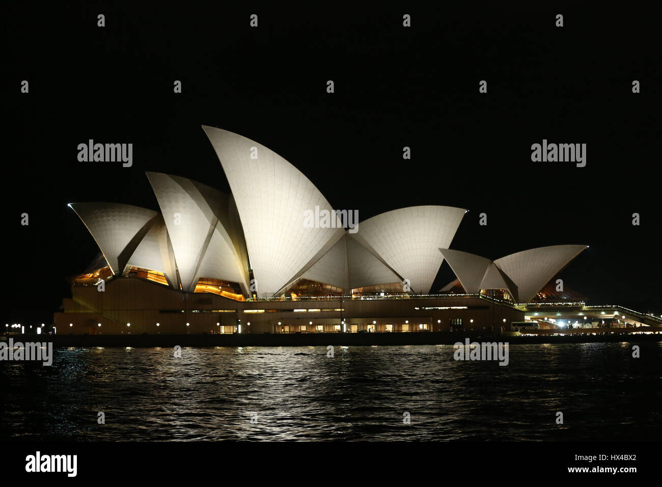 Sydney, Australia. 25 March 2017. The lights of the Sydney Opera House and the Sydney Harbour Bridge were turned off for one hour from 8:30pm to 9:30pm to mark ‘Earth Hour’. Pictured: Sydney Opera House just before Earth Hour. Credit: © Richard Milnes/Alamy Live News Stock Photo