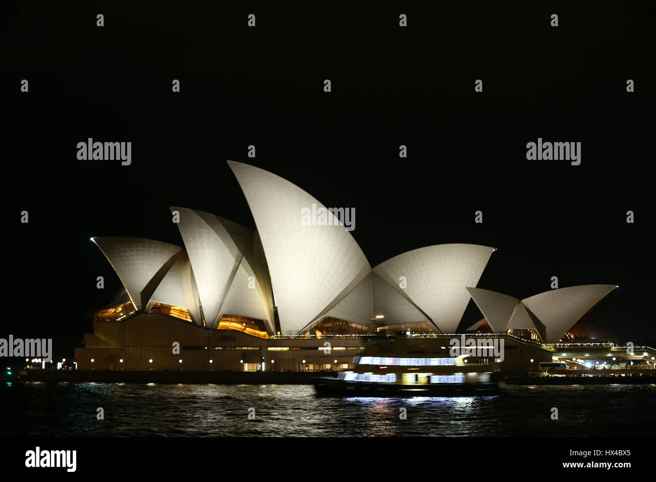 Sydney, Australia. 25 March 2017. The lights of the Sydney Opera House and the Sydney Harbour Bridge were turned off for one hour from 8:30pm to 9:30pm to mark ‘Earth Hour’. Pictured: Sydney Opera House just before Earth Hour. Credit: © Richard Milnes/Alamy Live News Stock Photo