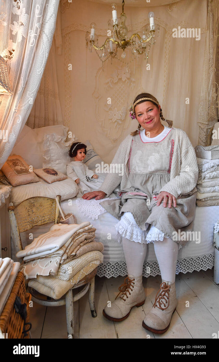 Zerpenschleuse, Germany. 24th Mar, 2017. Ines Schweighoefer sits in her  antique barn Emma Emmelie antiques for rustic antiques, fabrics, textile  and art in Zerpenschleuse, Germany, 24 March 2017. Photo: Patrick  Pleuldpa-ZentralbildZBdpaAlamy Live