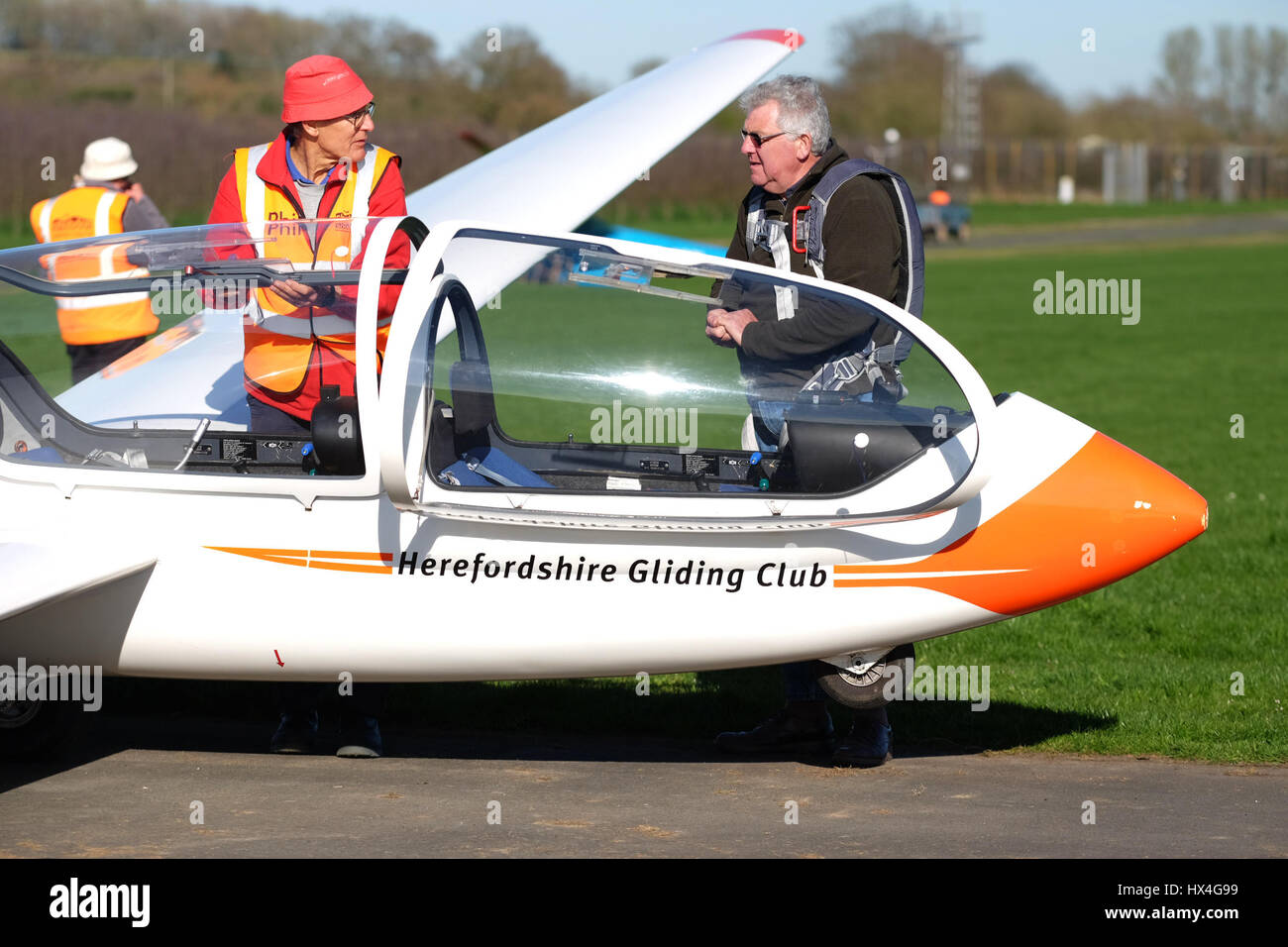 Shobdon airfield, Herefordshire UK - Busy day at Herefordshire Gliding Club on a day of perfect spring weather.Club members prepare a two seat Grob Twin Acro training glider for flight. Stock Photo