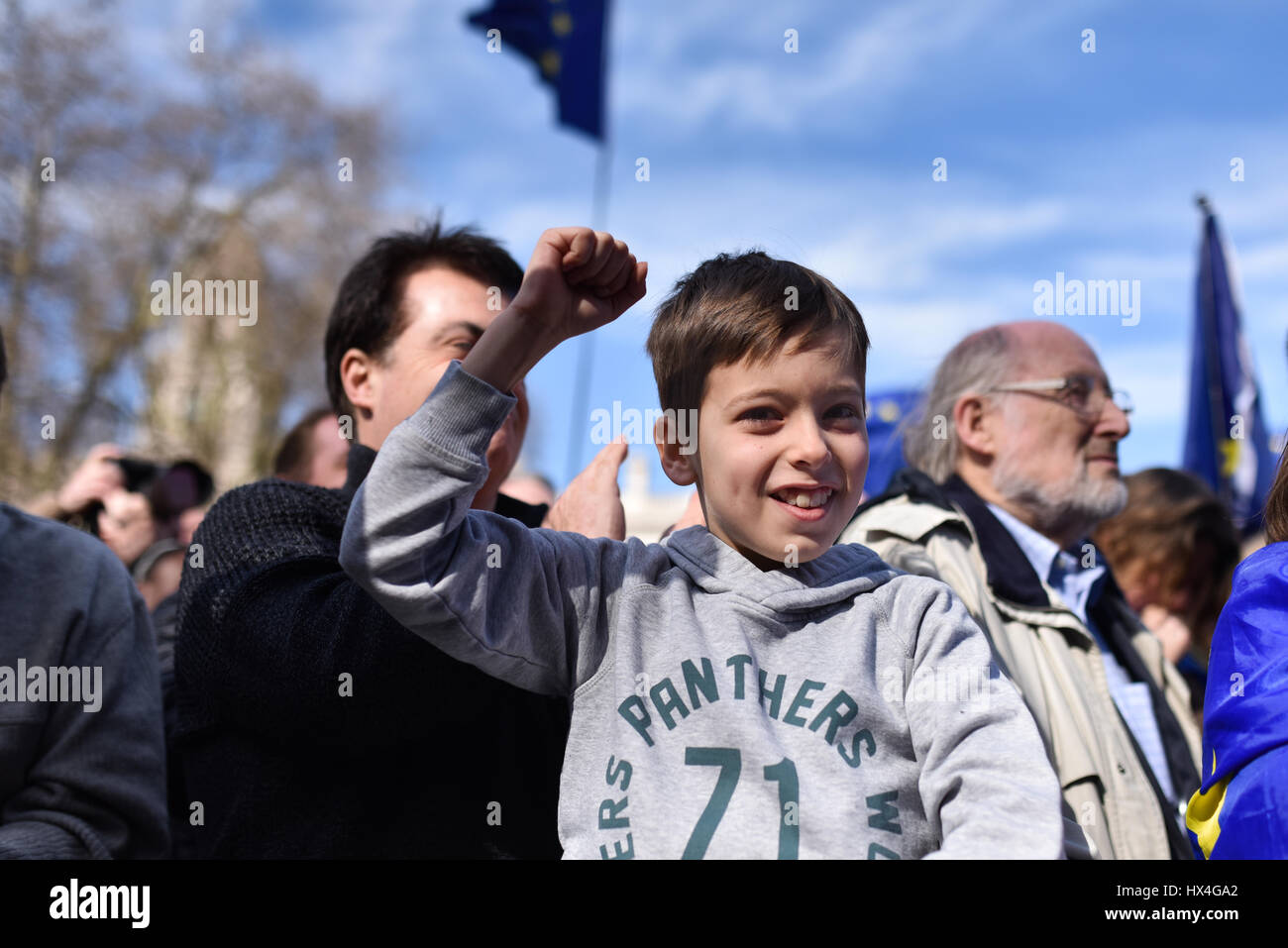 London, UK. 25th Mar, 2017. A young pro-EU protester on the March for Europe cheers in Parliament Square. Thousands marched from Park Lane to Parliament Square to oppose Brexit and support the European Union. Credit: Jacob Sacks-Jones/Alamy Live News. Stock Photo