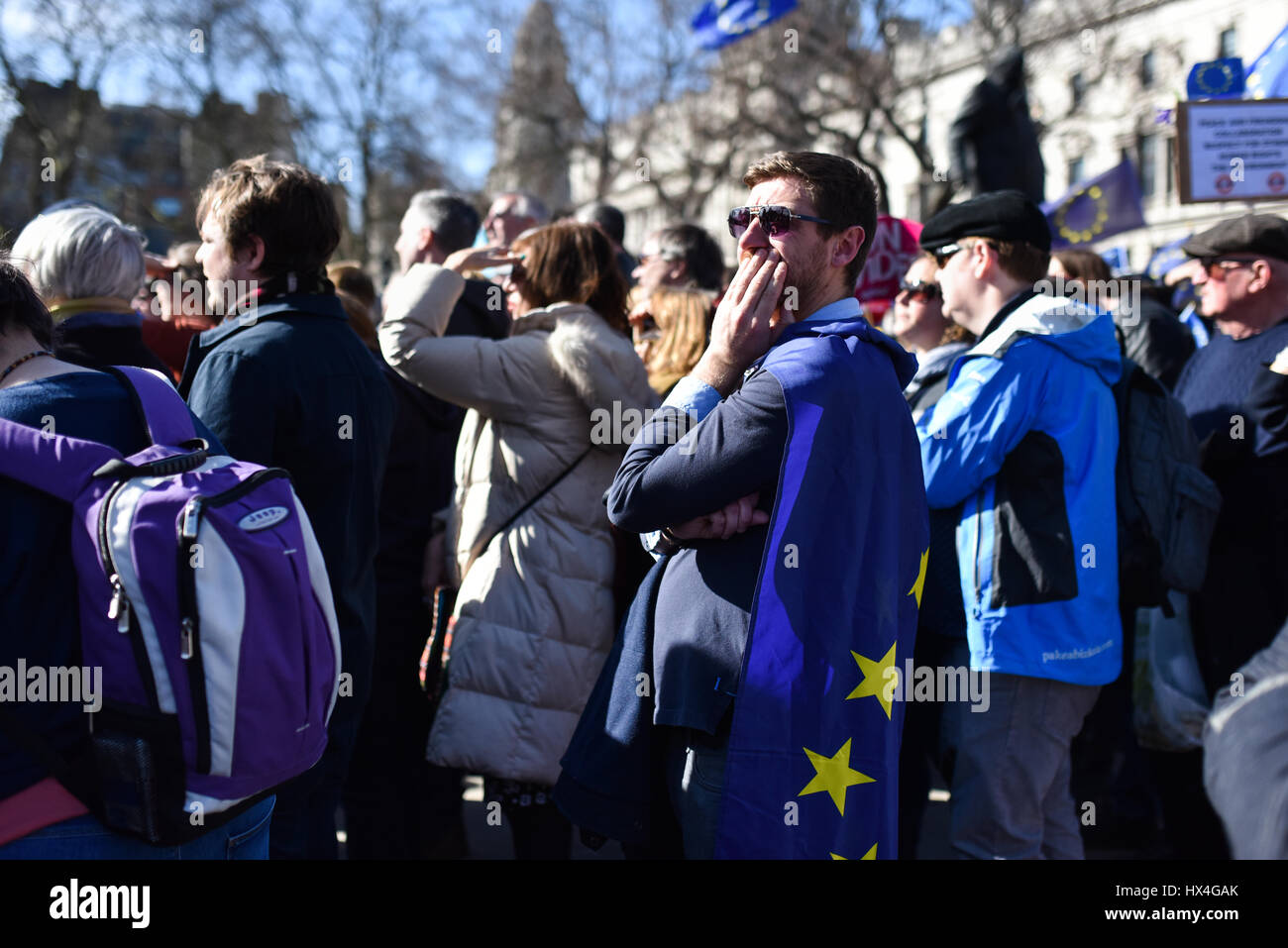 London, UK. 25th Mar, 2017. A pro-EU protester listens to speeches in Parliament Square, following the March for Europe. Thousands marched from Park Lane to Parliament Square to oppose Brexit and support the European Union. Credit: Jacob Sacks-Jones/Alamy Live News. Stock Photo