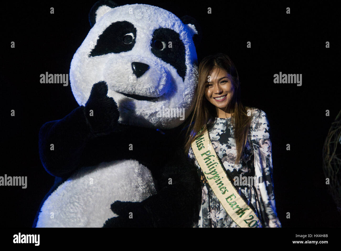 Philippines. 25th Mar, 2017. Miss Philippines Earth 2016 Loren Mar Artajos with Chi-chi the panda at the Mall of Asia in Pasay City. The 10th year anniversary of the one hour switch off was held at the Mall of Asia, SM by the Bay, with participants from different environmental groups lead by the World Wildlife Fund. Credit: J Gerard Seguia/ZUMA Wire/Alamy Live News Stock Photo
