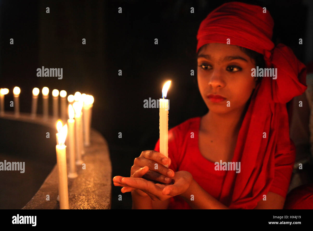 Dhaka, Bangladesh. 25th Mar, 2017. 25 March 2017 Dhaka, Bangladesh - A Bangladeshi childran lit candles to remember the victims of ''Operation Searchlight,'' the 1971 military operation carried out by the Pakistan Army to curb the Bengali nationalist movement in the Dhaka City on 25 March 2017. The black night of March 25, 1971 when the Pakistani occupation forces kicked off one of the worst genocides in history that led to a nine-month war for the independence of Bangladesh in 1971. Credit: ZUMA Press, Inc./Alamy Live News Stock Photo