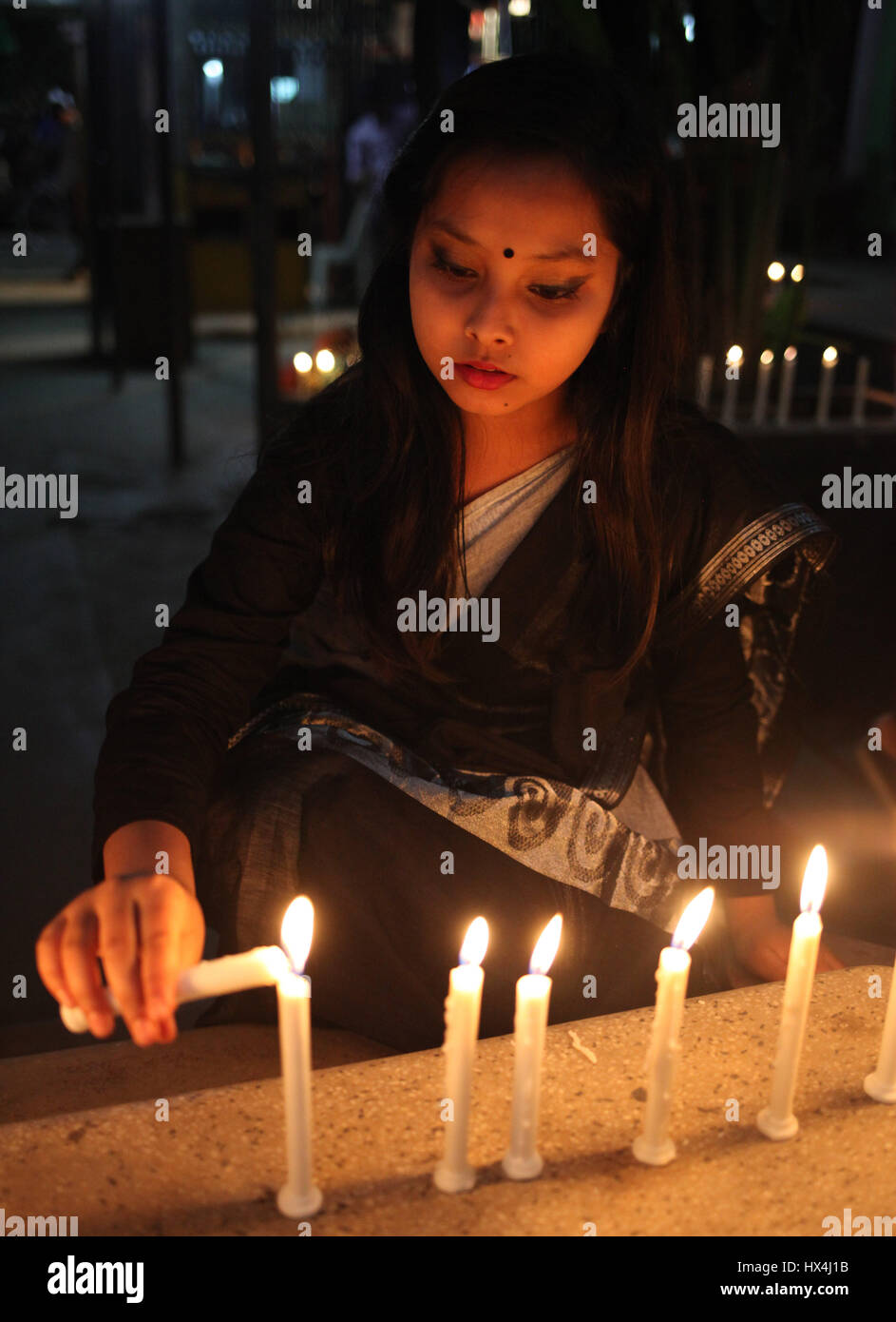 Dhaka, Bangladesh. 25th Mar, 2017. 25 March 2017 Dhaka, Bangladesh -Bangladeshi girl lit candles and to remember the victims of ''Operation Searchlight,'' the 1971 military operation carried out by the Pakistan Army to curb the Bengali nationalist movement in the Dhaka City on 25 March 2017. The black night of March 25, 1971 when the Pakistani occupation forces kicked off one of the worst genocides in history that led to a nine-month war for the independence of Bangladesh in 1971. Credit: ZUMA Press, Inc./Alamy Live News Stock Photo