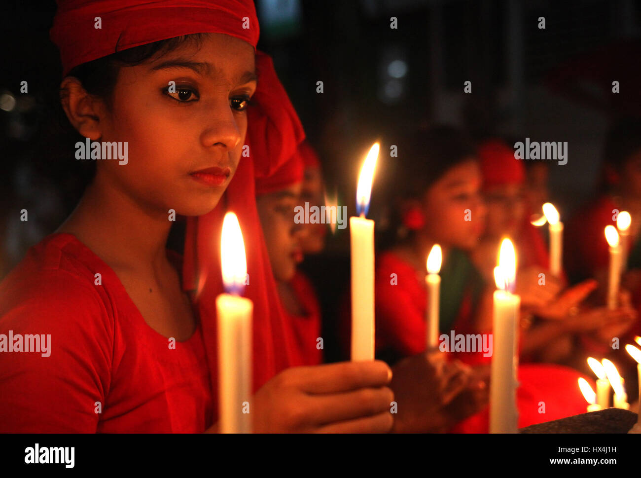 Dhaka, Bangladesh. 25th Mar, 2017. 25 March 2017 Dhaka, Bangladesh - Bangladeshi childranlit candles to remember the victims of ''Operation Searchlight,'' the 1971 military operation carried out by the Pakistan Army to curb the Bengali nationalist movement in the Dhaka City on 25 March 2017. The black night of March 25, 1971 when the Pakistani occupation forces kicked off one of the worst genocides in history that led to a nine-month war for the independence of Bangladesh in 1971. Credit: ZUMA Press, Inc./Alamy Live News Stock Photo