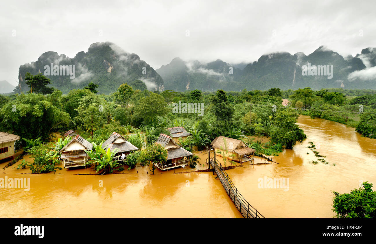floating river in vangvieng lao after raining day at the morning time with the mist on the hill Stock Photo