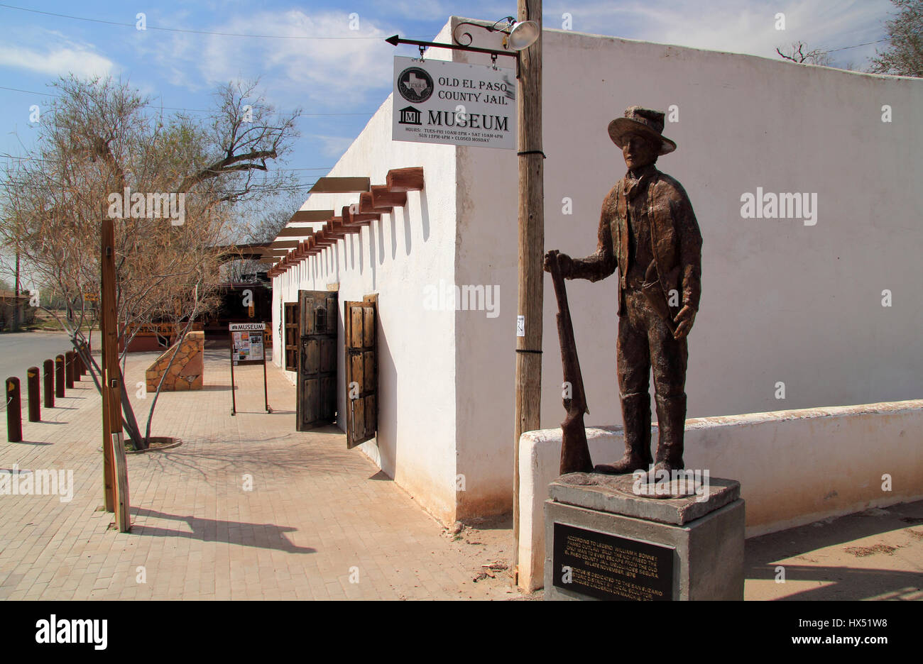 Old El Paso County Jail with Billy the Kid Monument in Foreground, San Elizario Art District, Texas Stock Photo