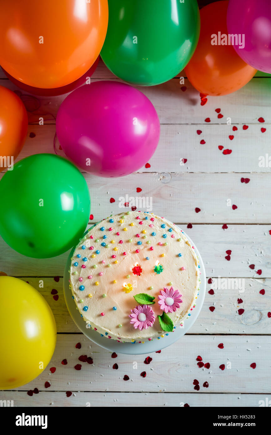 Beautifully decorated birthday cake with lighted candles Stock Photo ...