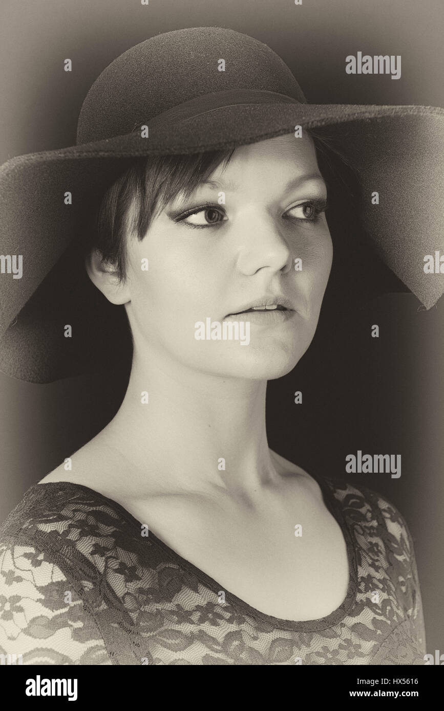Portrait of a young woman in a black dress Stock Photo - Alamy