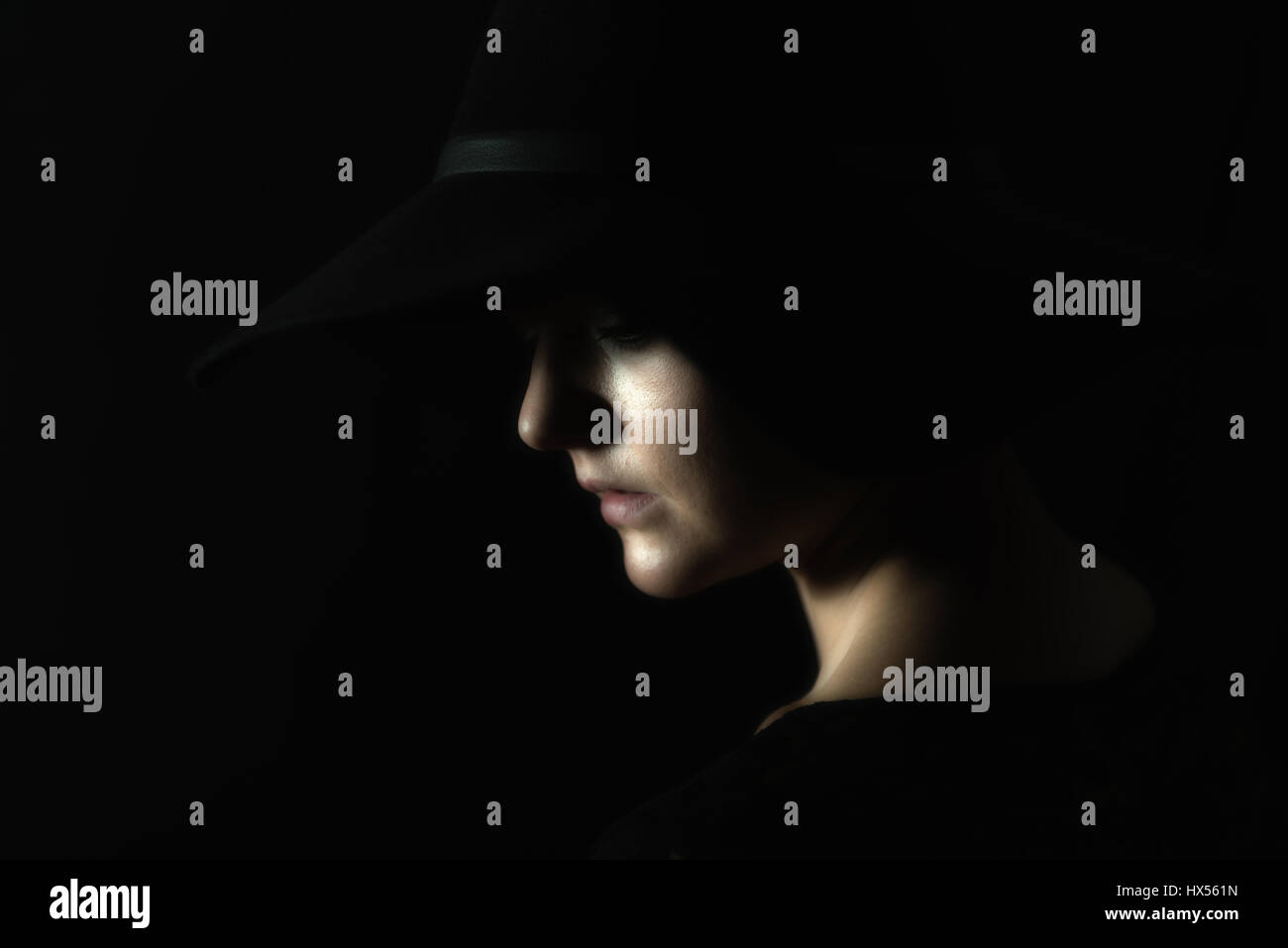 Portrait of a young woman with ablack hat Stock Photo - Alamy