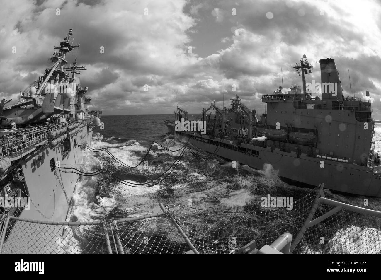 Amphibious assault ship USS Kearsarge (LHD 3) and Military Sealift Command fleet replenishment oiler USNS Big Horn (T-AO 198) during a replenishment-at-sea, Atlantic Ocean, 2013. Image courtesy Corbin Shea/US Navy. Stock Photo