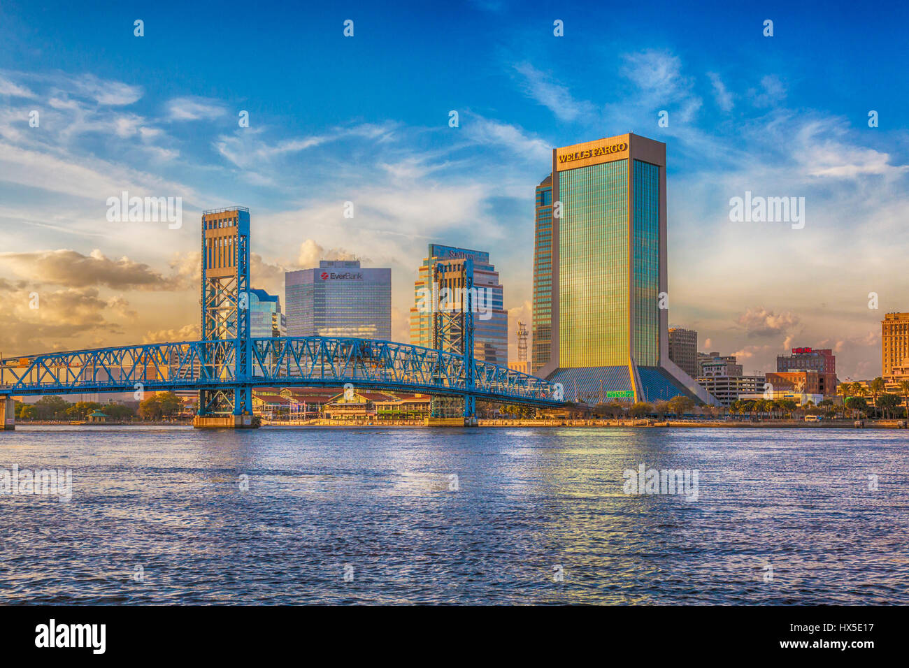 Sunset on downtown buildings and bridges on St Johns River in downtown Jacksonville, Florida. Stock Photo